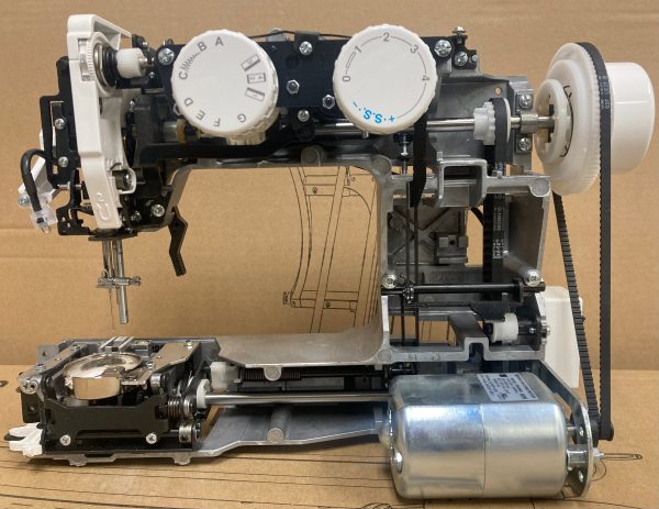 Sewing Machine frame with Internal Cast Metal Alloy